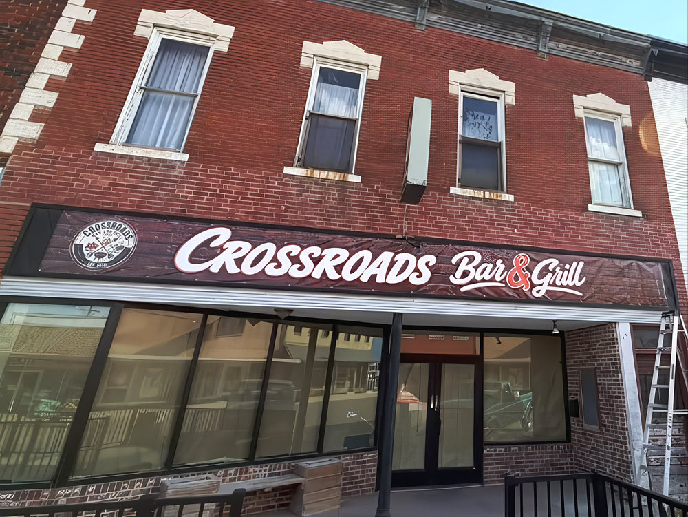Crossroads Bar & Grill storefront with its new banner