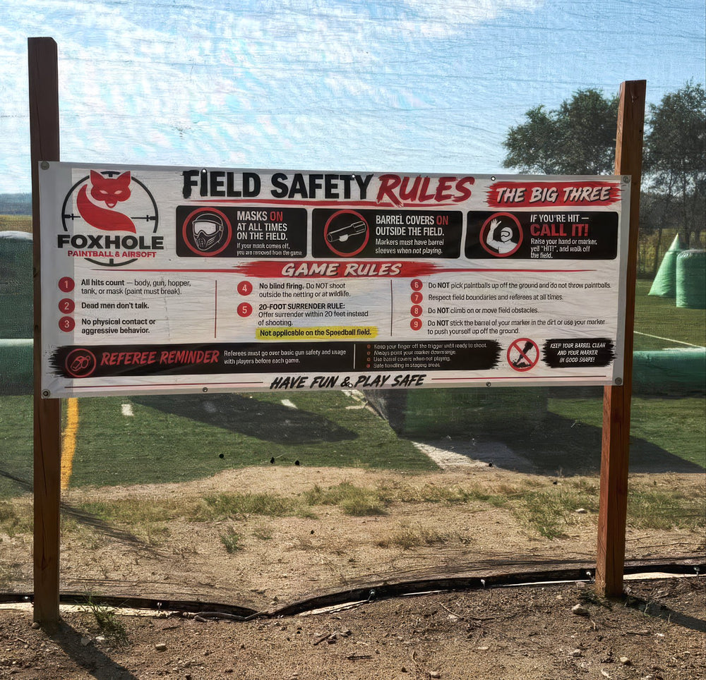 Foxhole Paintball & Airsoft field safety rules banner hung at the field